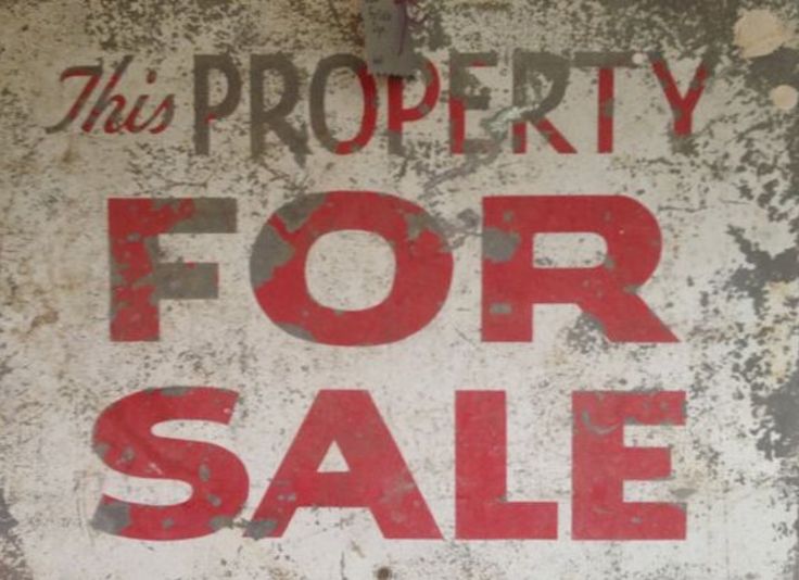 old and new yard sign